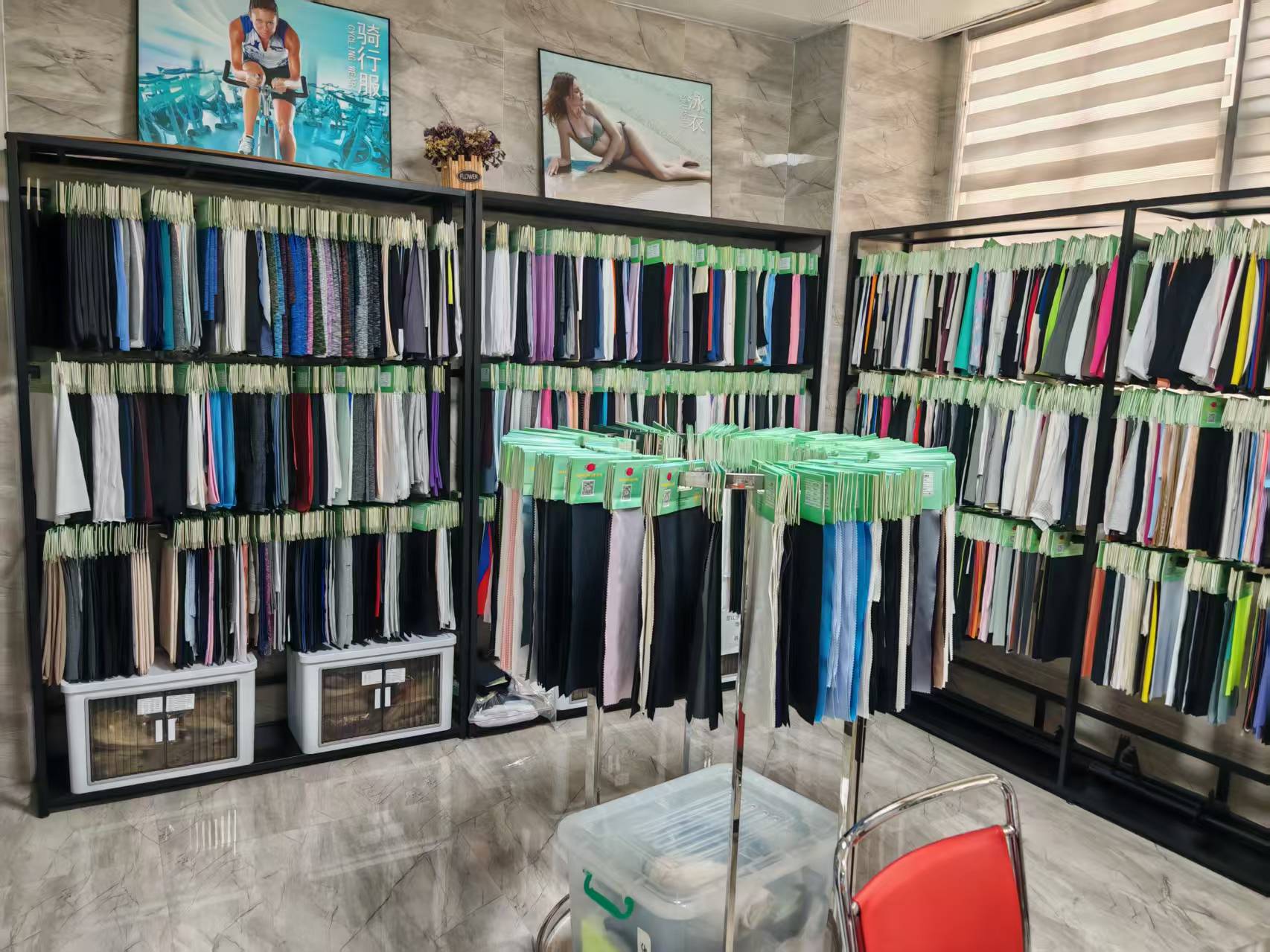 Fabric showroom — swatch wall of knitted functional fabrics